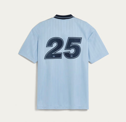 Blue Adidas OASIS TOUR short sleeve jersey from the World Cup Retro Soccer Shop, featuring classic sports design and branding.