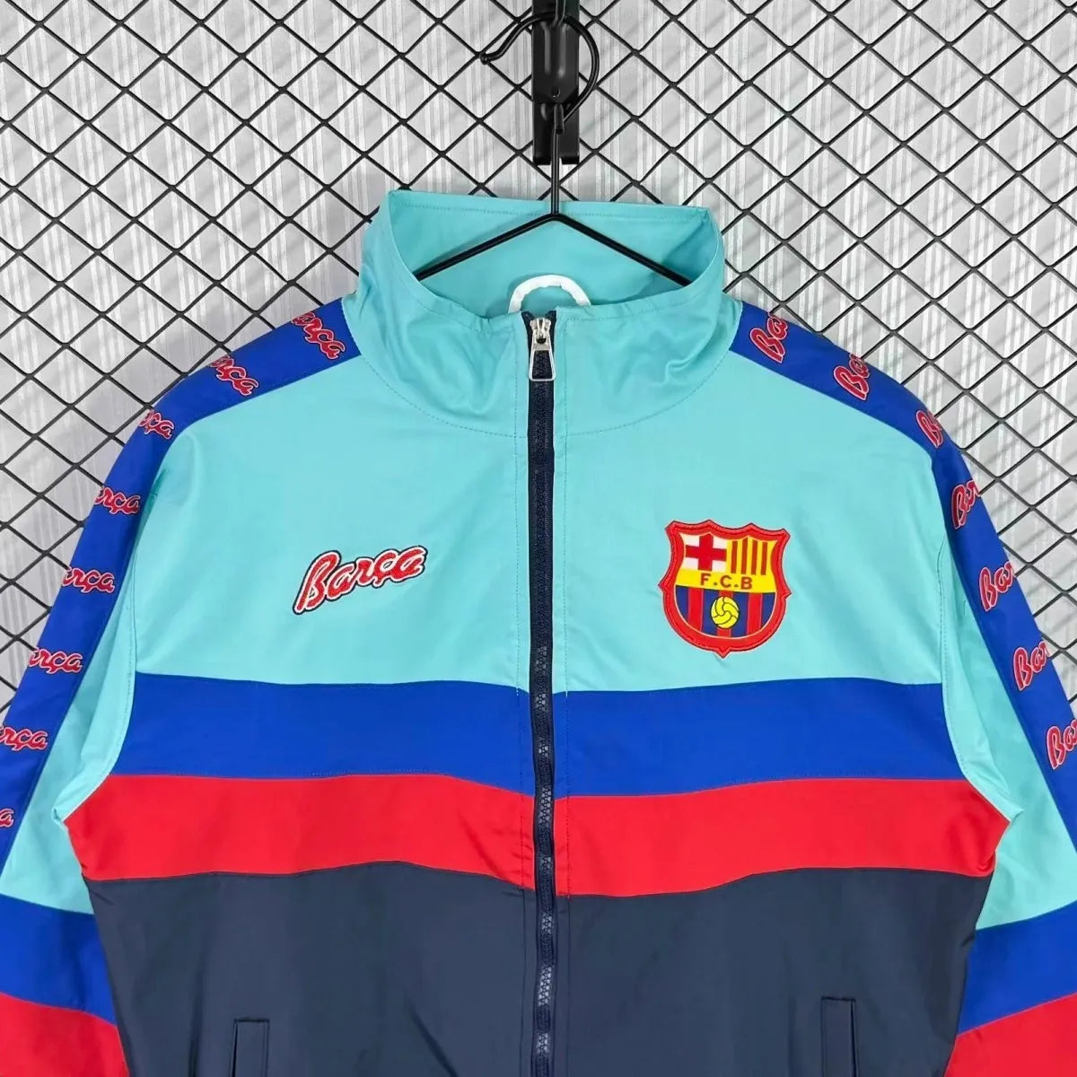 Barcelona FC 95/97 retro long sleeve track jacket with team logo, white and blue design, shown on a hanger.