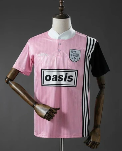 Pink and black Adidas Oasis Tour short sleeve soccer jersey with "Bolt Makers Arms" edition, featuring team logos and design details.