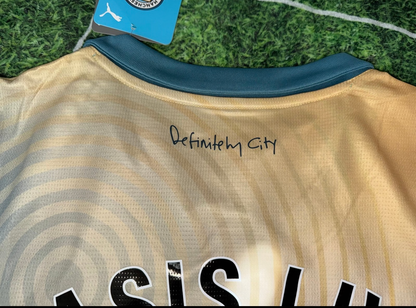 Manchester City FC 24/25 fourth jersey with "Definitely Maybe" album special edition, short sleeve, displayed on a hanger.