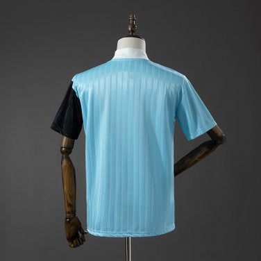 Adidas OASIS TOUR short sleeve soccer jersey in blue and black with "Bolt Makers Arms" edition, featuring team and brand logos.
