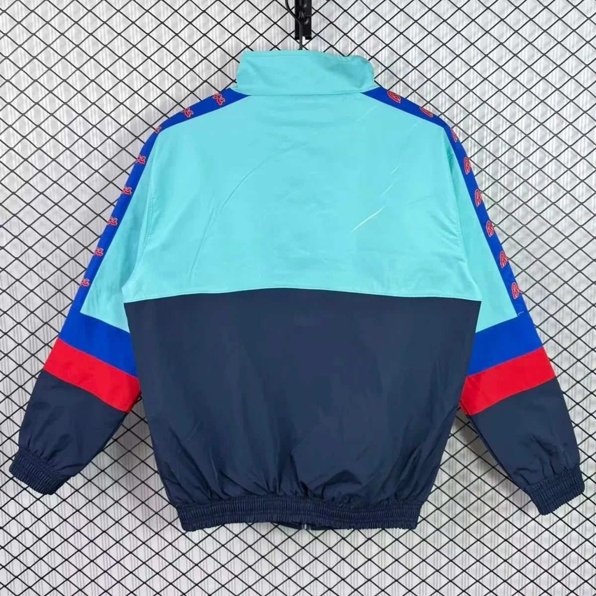 Barcelona FC 95/97 retro long sleeve track jacket, blue with team crest, worn by a model on a plain background.