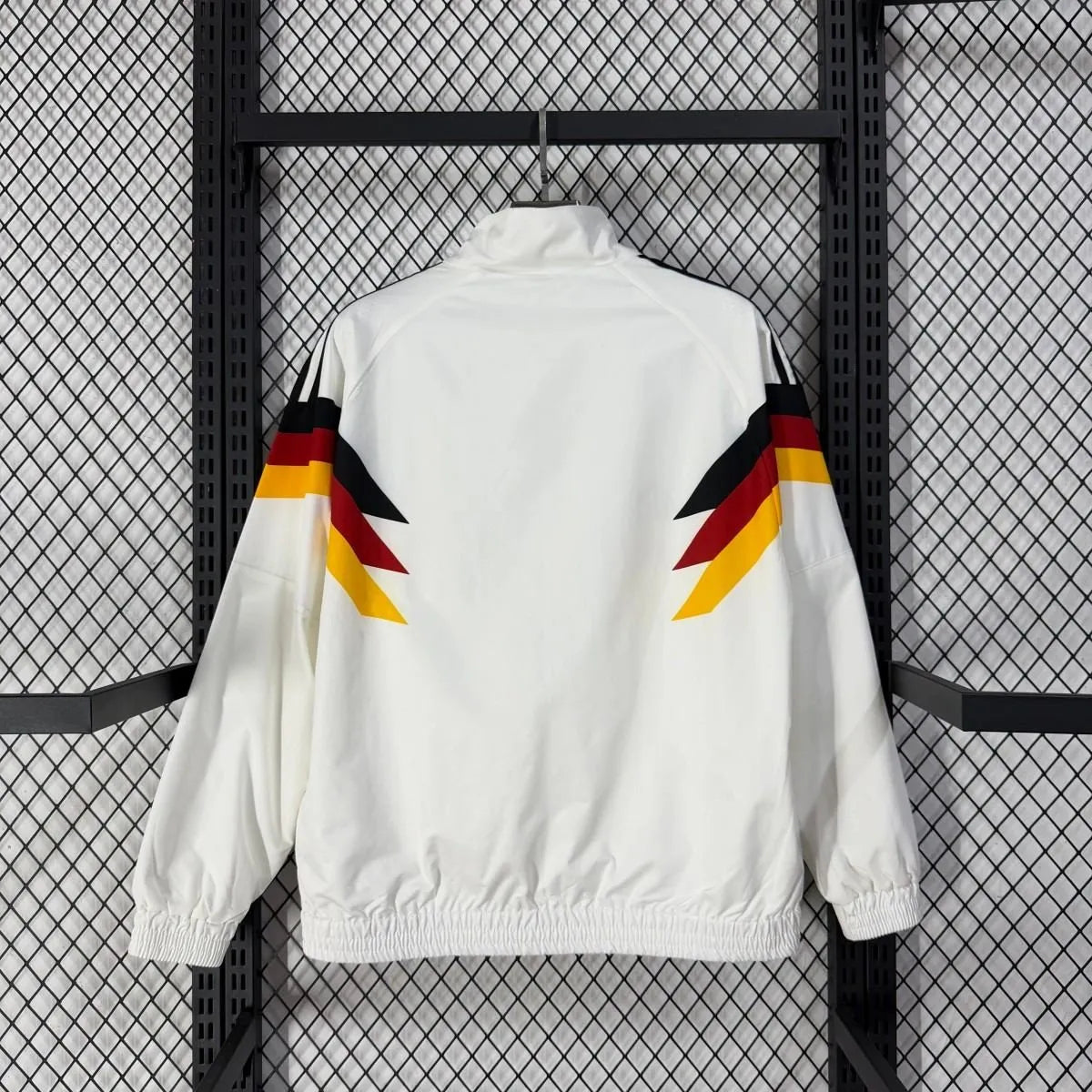 Long sleeve West Germany 1990 retro track jacket with classic design, featuring team colors and vintage soccer style.