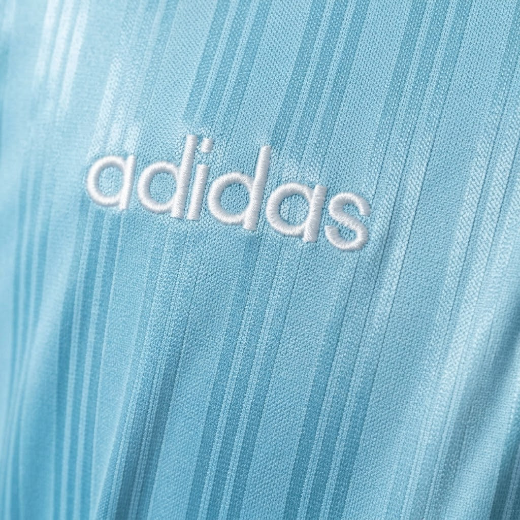 Adidas Oasis Tour Bolt Makers Arms edition blue and black short sleeve soccer jersey, featuring bold design and athletic fit.