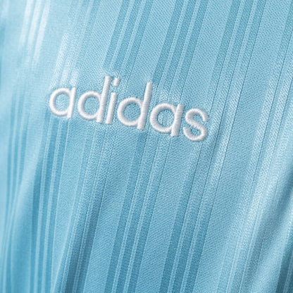 Adidas Oasis Tour Bolt Makers Arms edition blue and black short sleeve soccer jersey, featuring bold design and athletic fit.