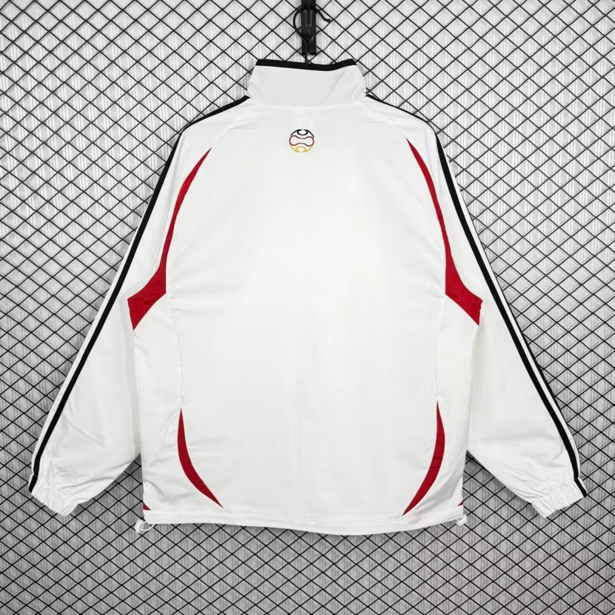 Germany 2005/06 all-weather retro soccer track jacket with long sleeves, featuring team graphics and classic sports design.