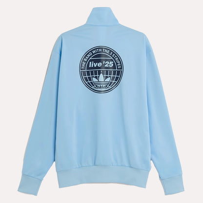 Adidas Original Oasis Tour blue long sleeve tracksuit jacket with sporty design, worn by a model on a plain background.