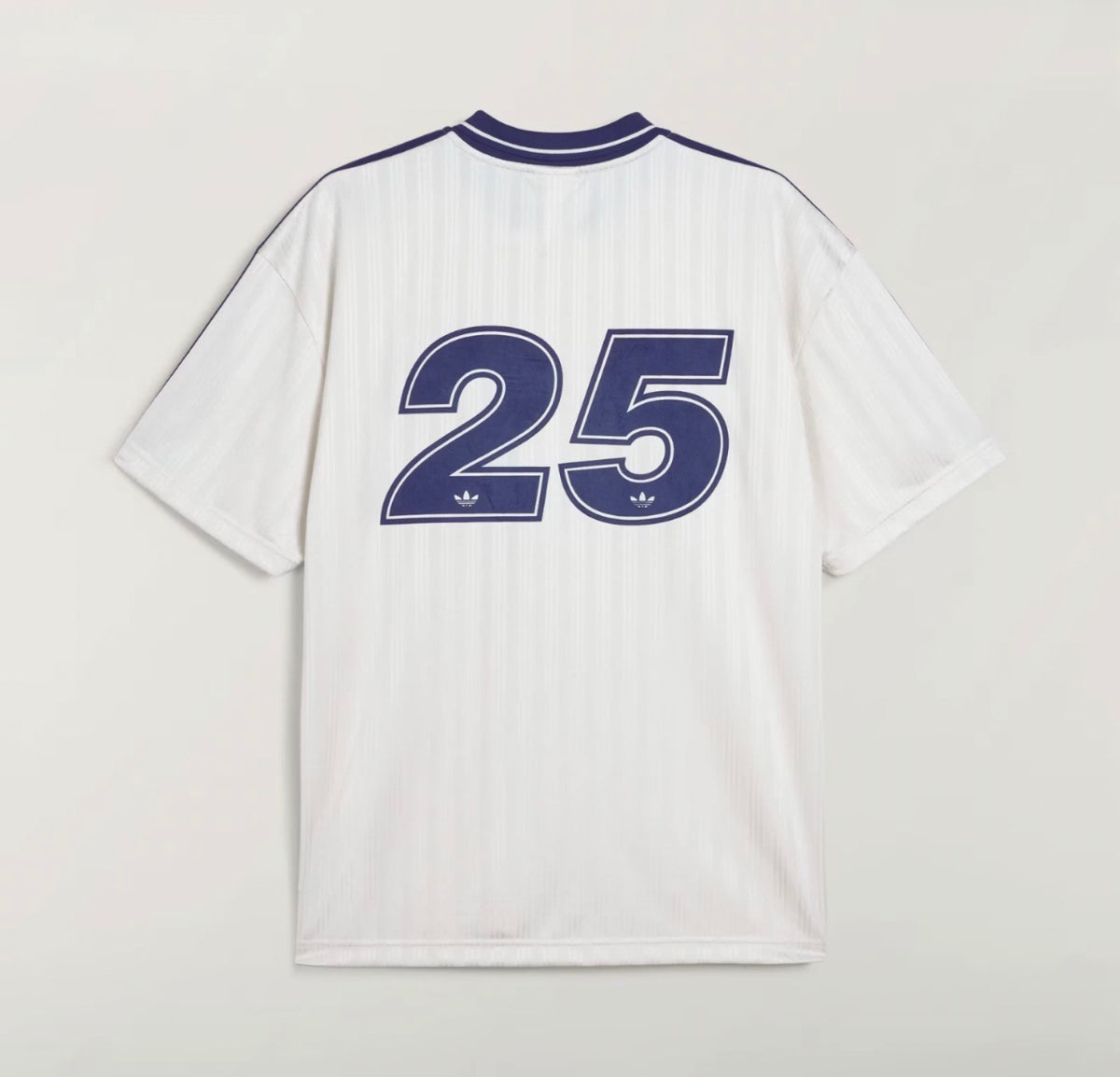 White Adidas OASIS TOUR Lifestyle short sleeve jersey with retro design, displayed on a hanger.