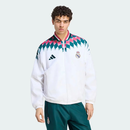 Real Madrid 26/27 all weather long sleeve track jacket in team colors with logo and design details.