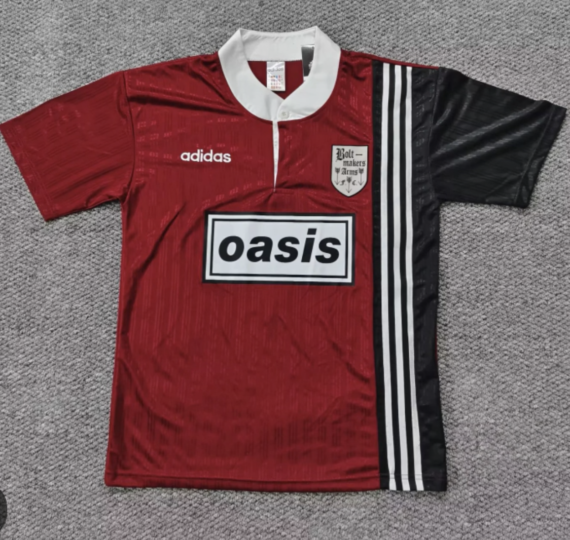 Red and black Adidas Oasis Tour short sleeve soccer jersey with "Bolt Makers Arms" edition, featuring bold design and team branding.