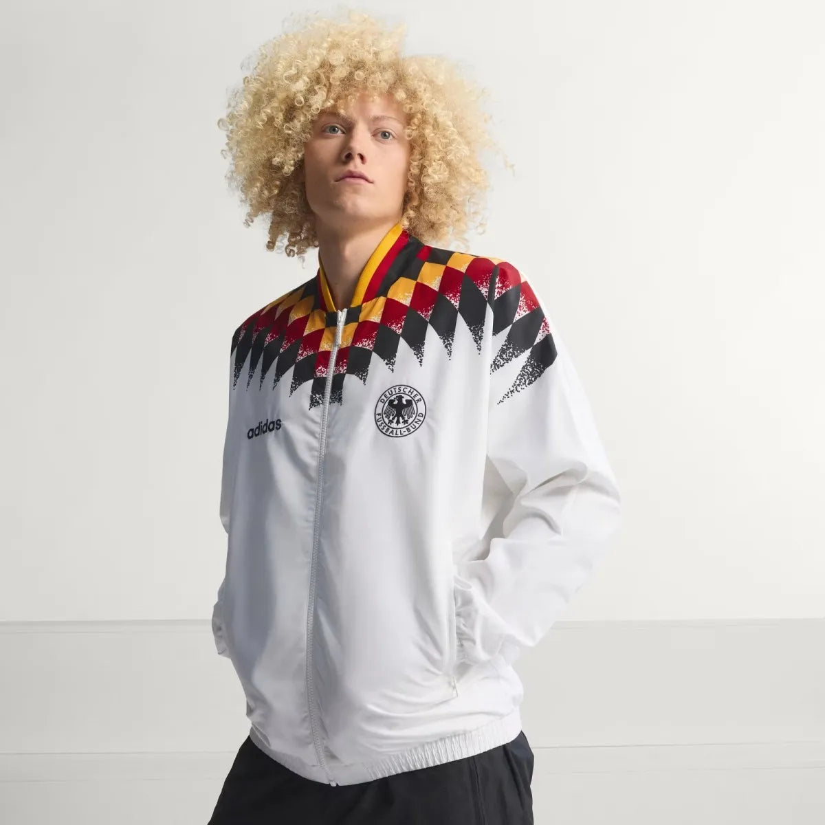 Germany 1994 retro long sleeve track jacket, classic soccer style with national team details, in vibrant colors.
