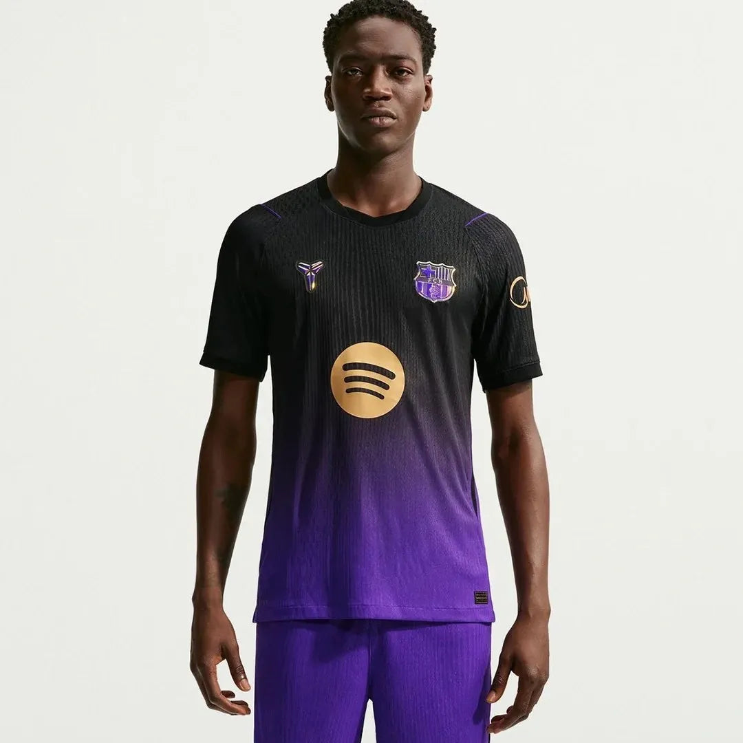 Barcelona FC 26/27 away jersey, short sleeve, Nike soccer shirt with team crest and vibrant blue and maroon colors.