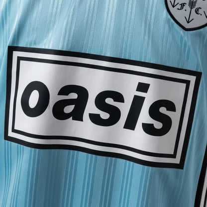 Adidas Oasis Tour short sleeve soccer jersey in blue and black with Bolt Makers Arms edition design.