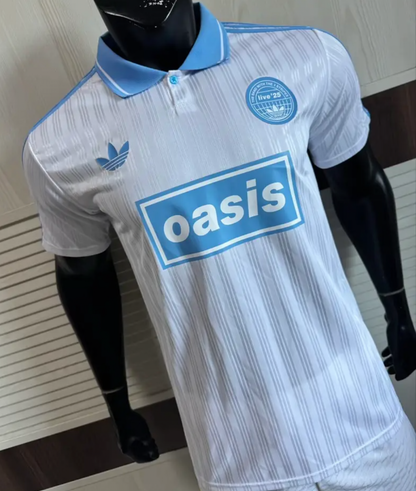 Adidas Oasis Tour “Bolt Makers Arms” edition white and sky blue short sleeve soccer jersey, vintage World Cup retro style.
