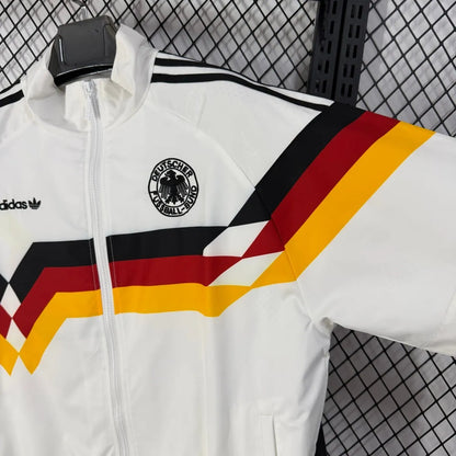 Long sleeve West Germany 1990 retro track jacket with classic soccer design, featuring vintage colors and World Cup retro branding.
