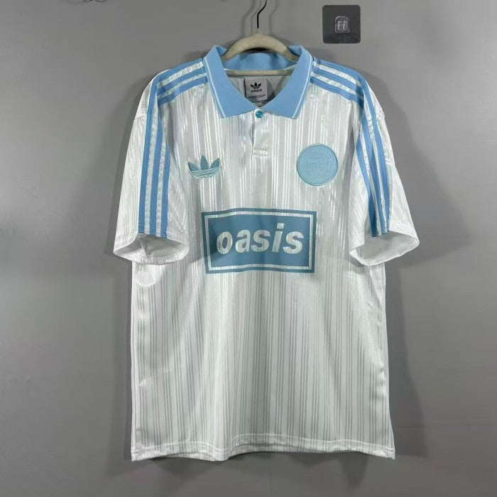Adidas OASIS TOUR “Bolt Makers Arms” edition white and sky blue short sleeve soccer jersey with team logos.