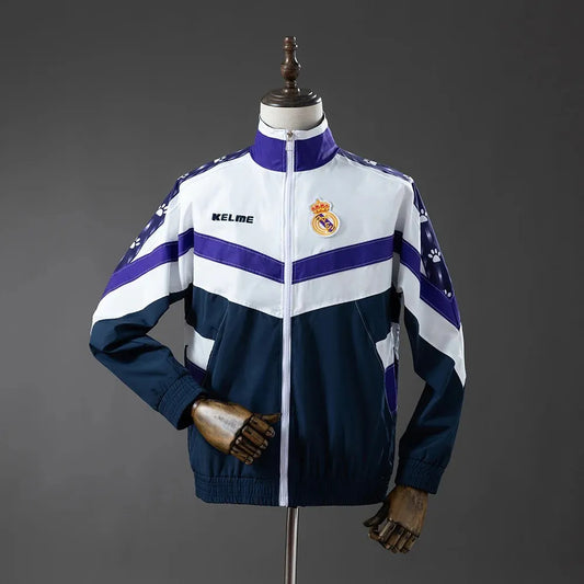 Real Madrid 94/97 retro long sleeve track jacket with team logo and stripes, vintage soccer style, from World Cup Retro Soccer Shop.