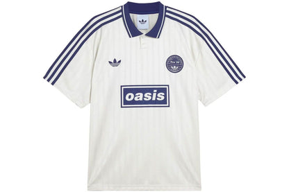 White Adidas OASIS TOUR Lifestyle short sleeve soccer jersey with team logo, displayed on a hanger.
