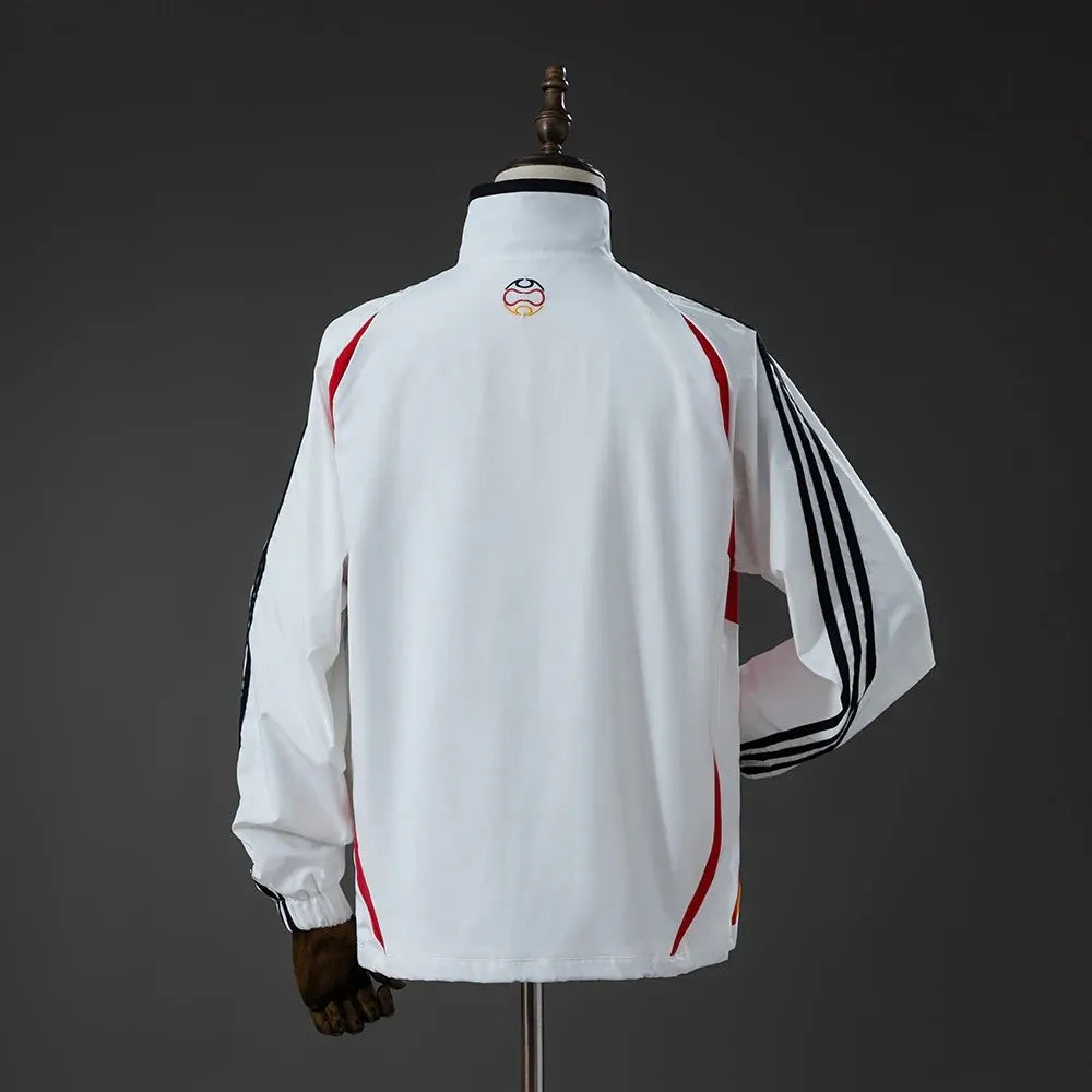 Germany 2005/06 all-weather retro track jacket, long sleeve soccer jacket with team logo, in navy and yellow colors.